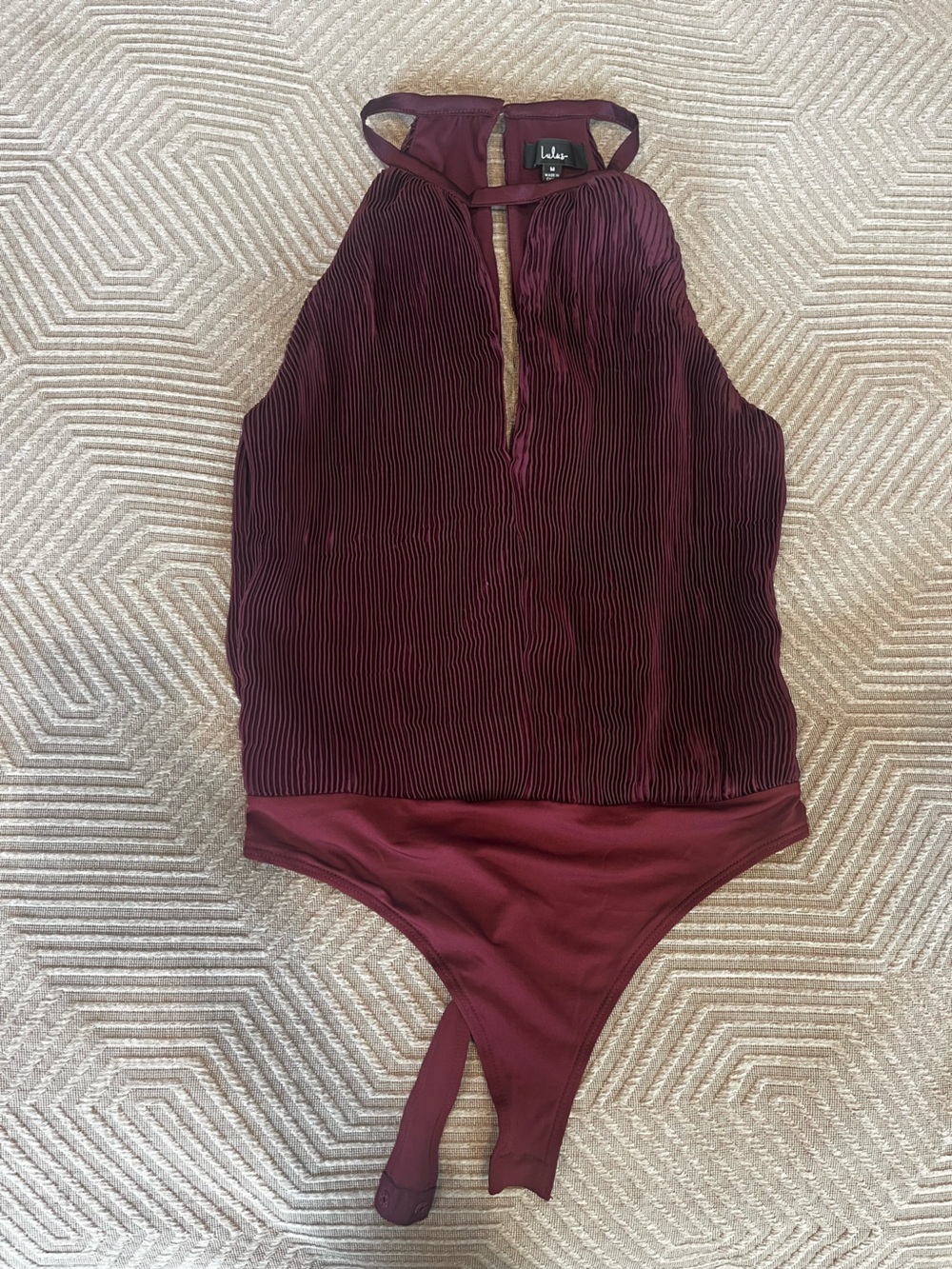 High neck, deep V purple body suit